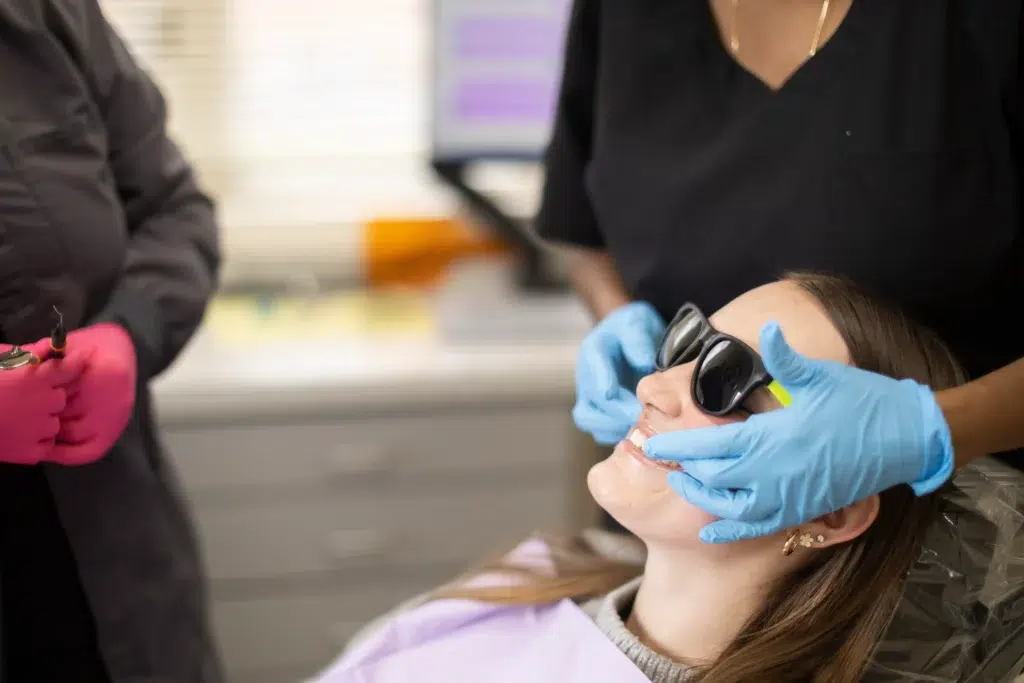 Dentist providing dental filling treatment to a patient